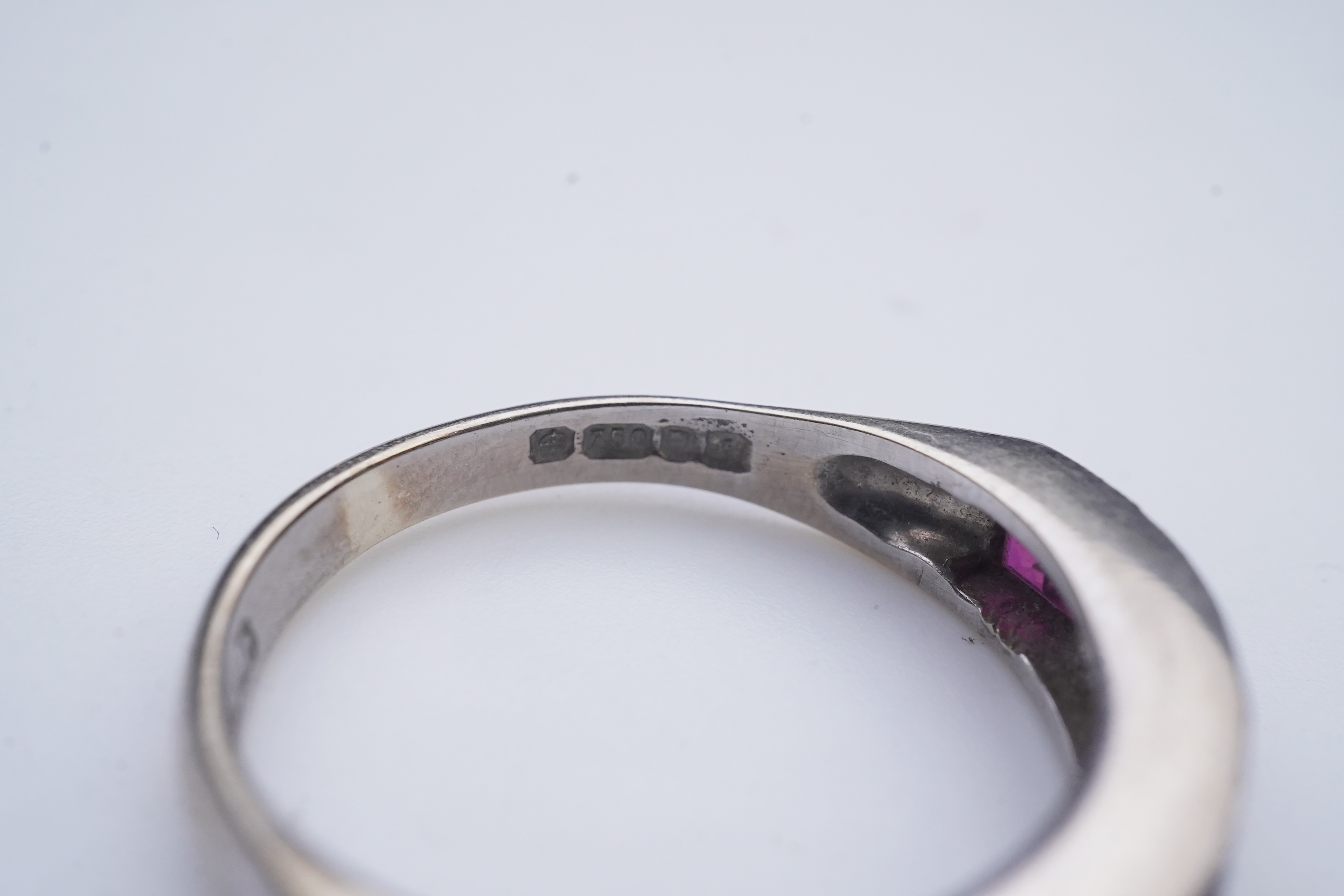 A ruby and diamond half eternity ring